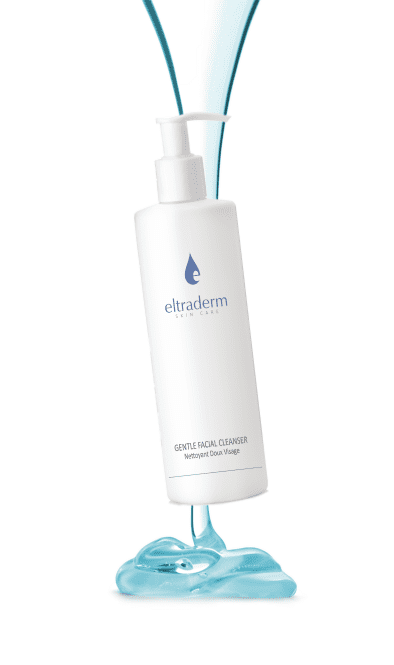 a white bottle with blue liquid flowing out